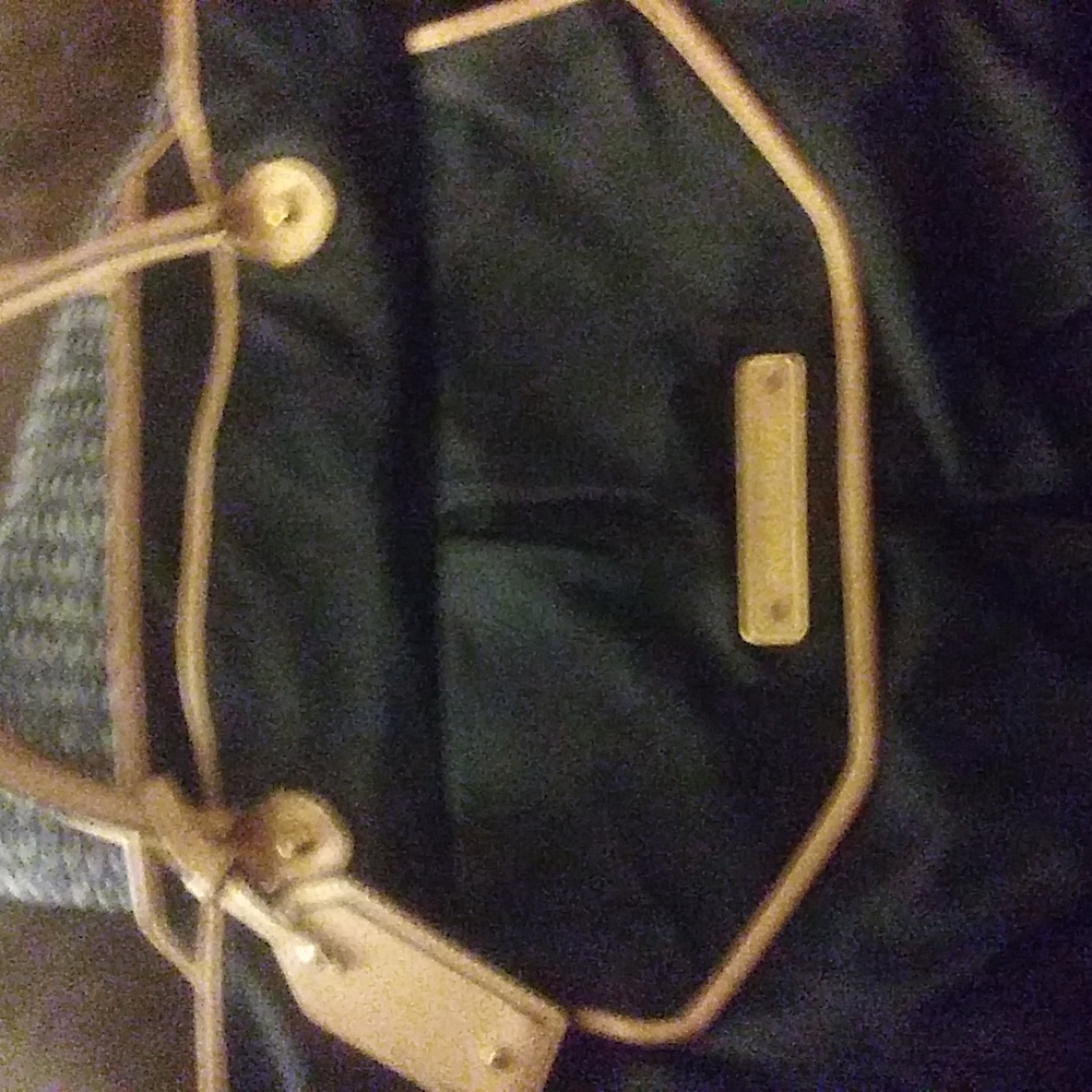 Juicy Couture handbag..used twice.. Small burn hole on inside..